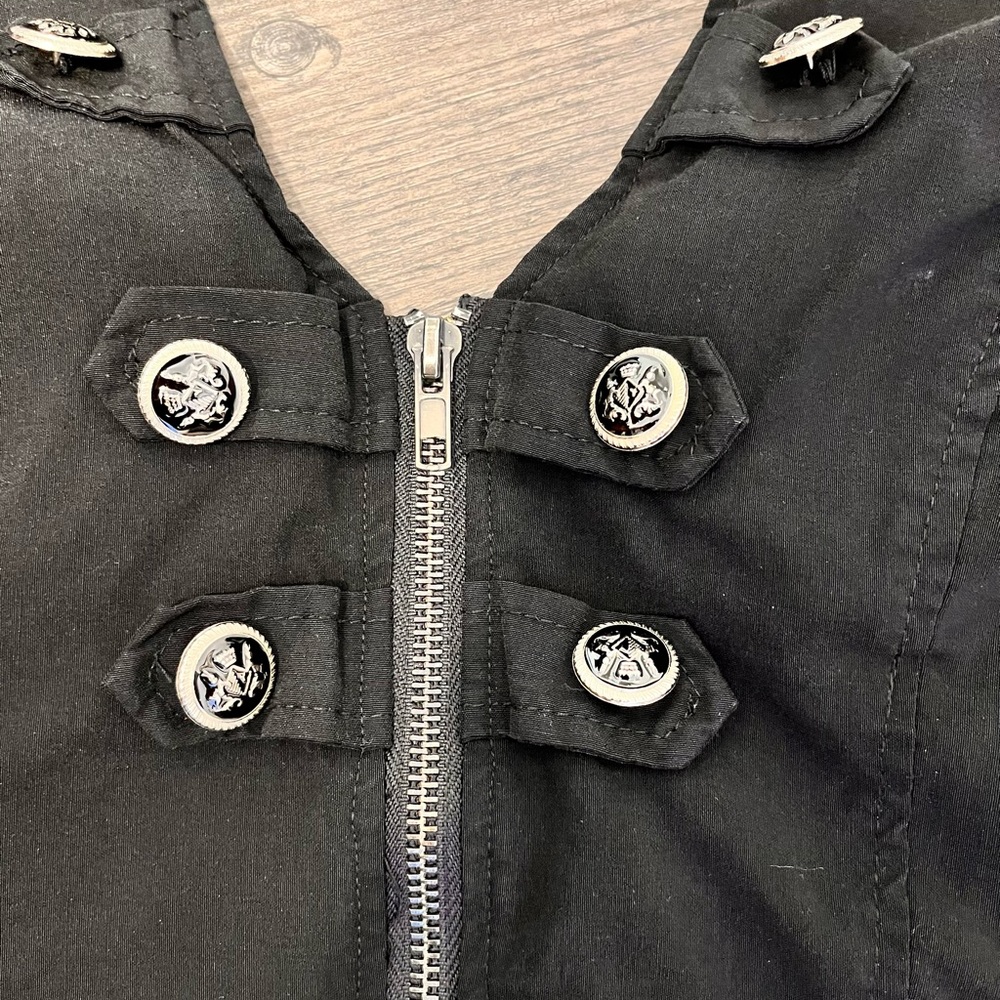 Black zip front backless halter top. military button details. Stretch fabric.
